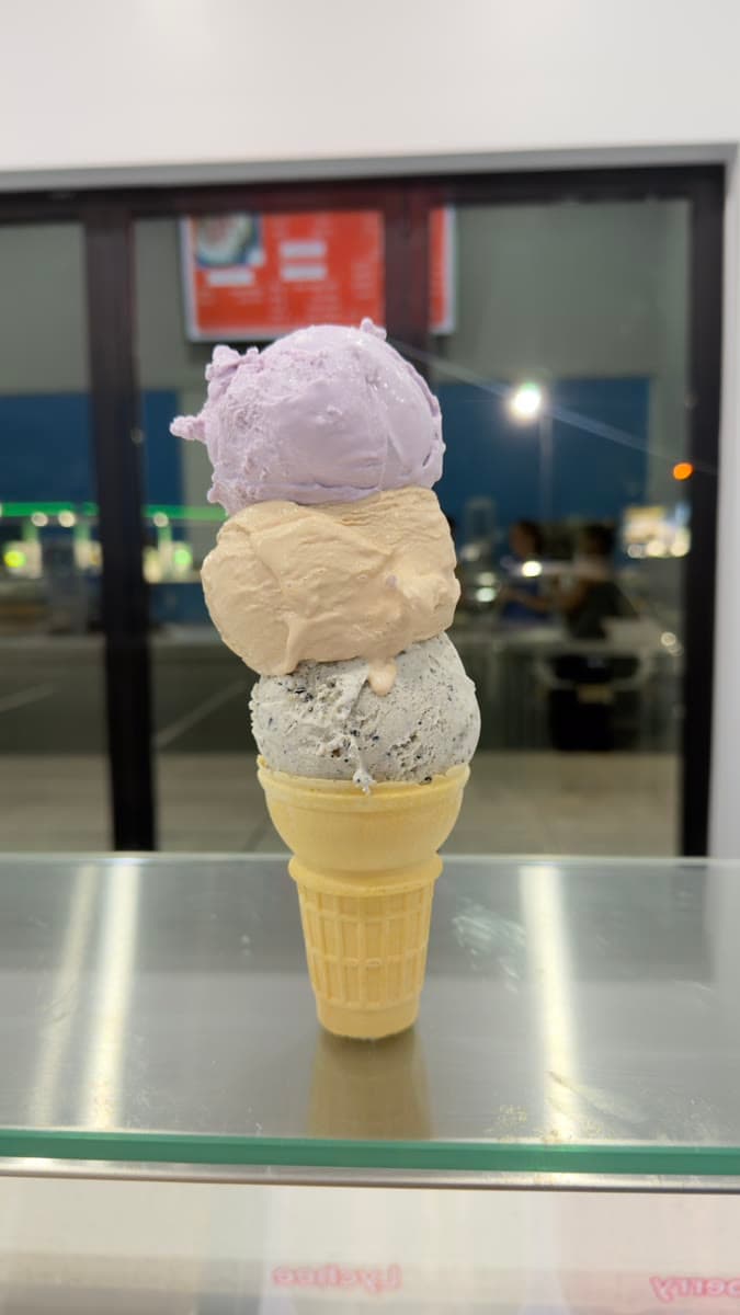 A triple scoop of taro, milk tea and cookies 'n cream